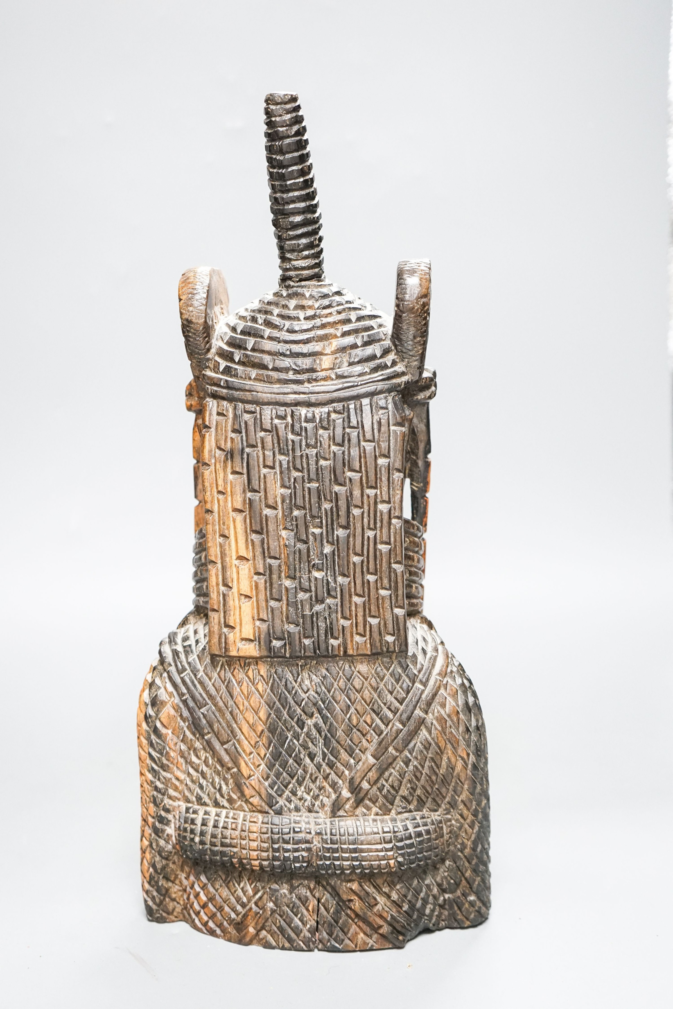 A Nigerian carved hardwood figure of KIng OBA 39cm